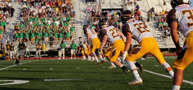 football game photo during daytime by Riley McCullough courtesy of Unsplash.